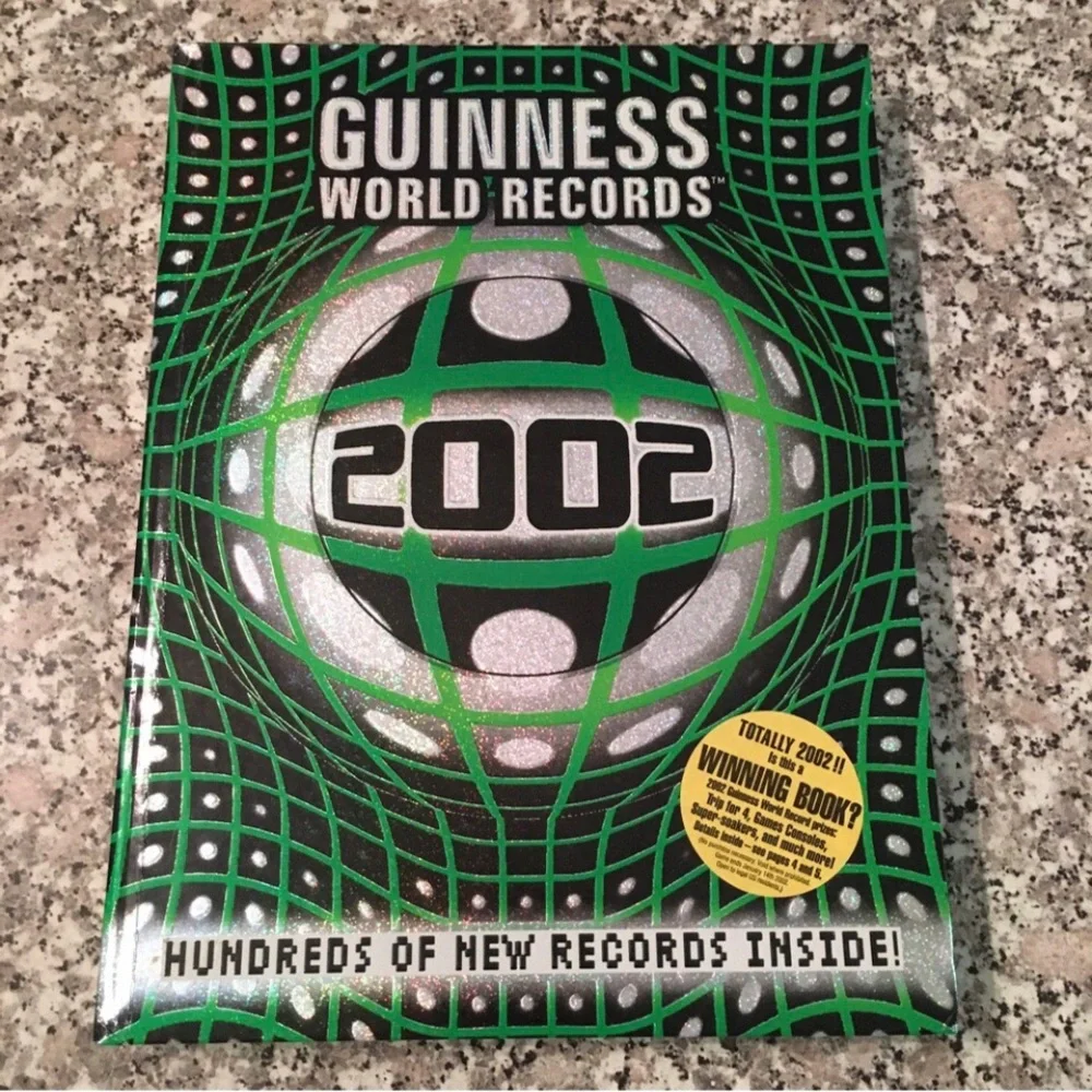 2002 book Guinness World Records hardcover photos illustrations web videos